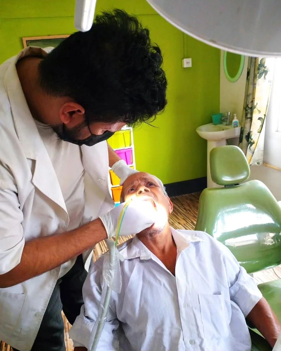 Dr. Dhyan Saharia treating a patient at the clinic